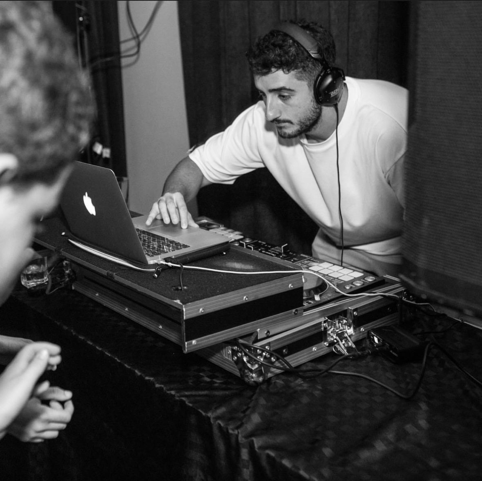 Benj leaning over the decks mid-set