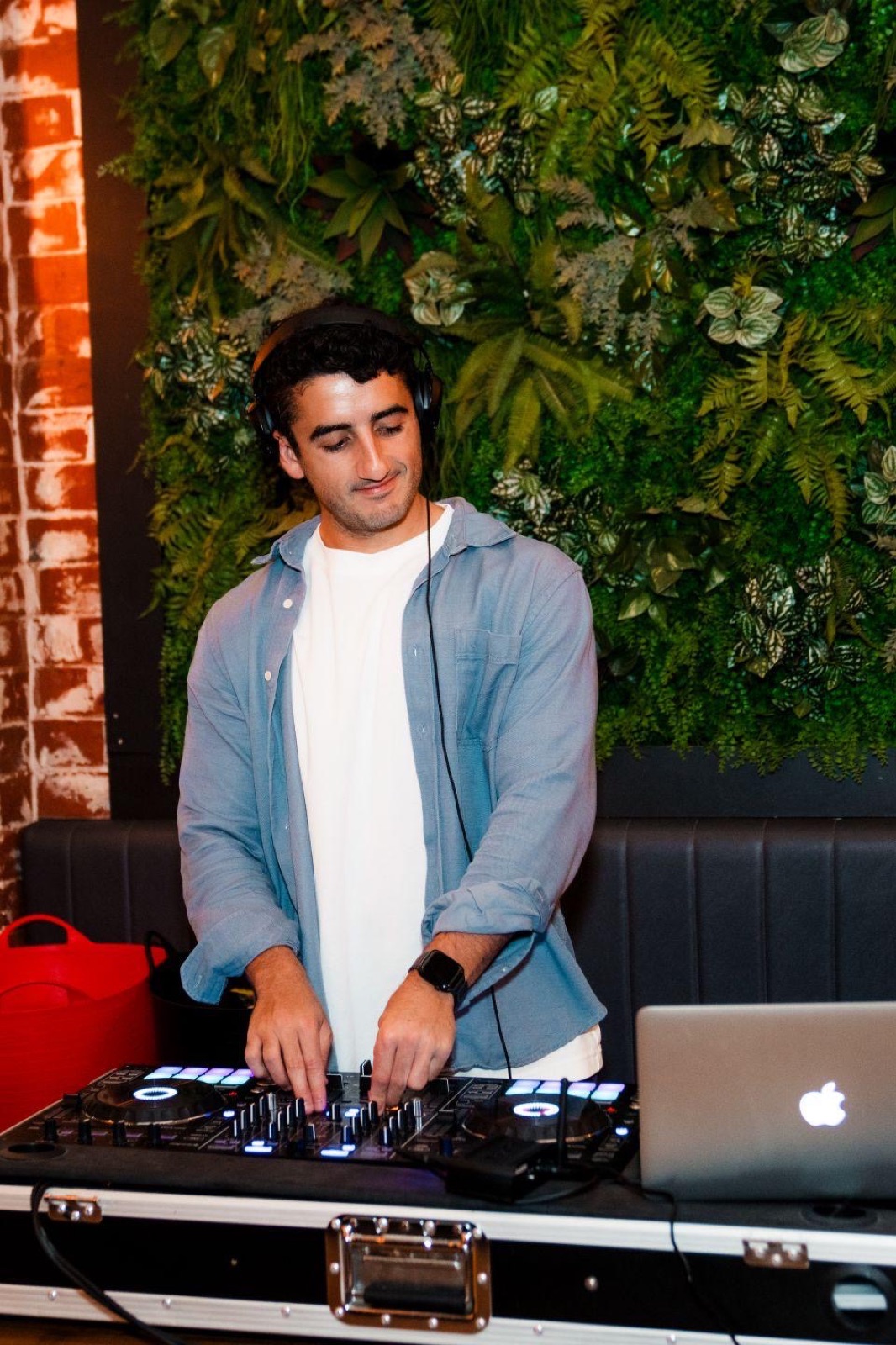Playing in front of a green wall at a venue