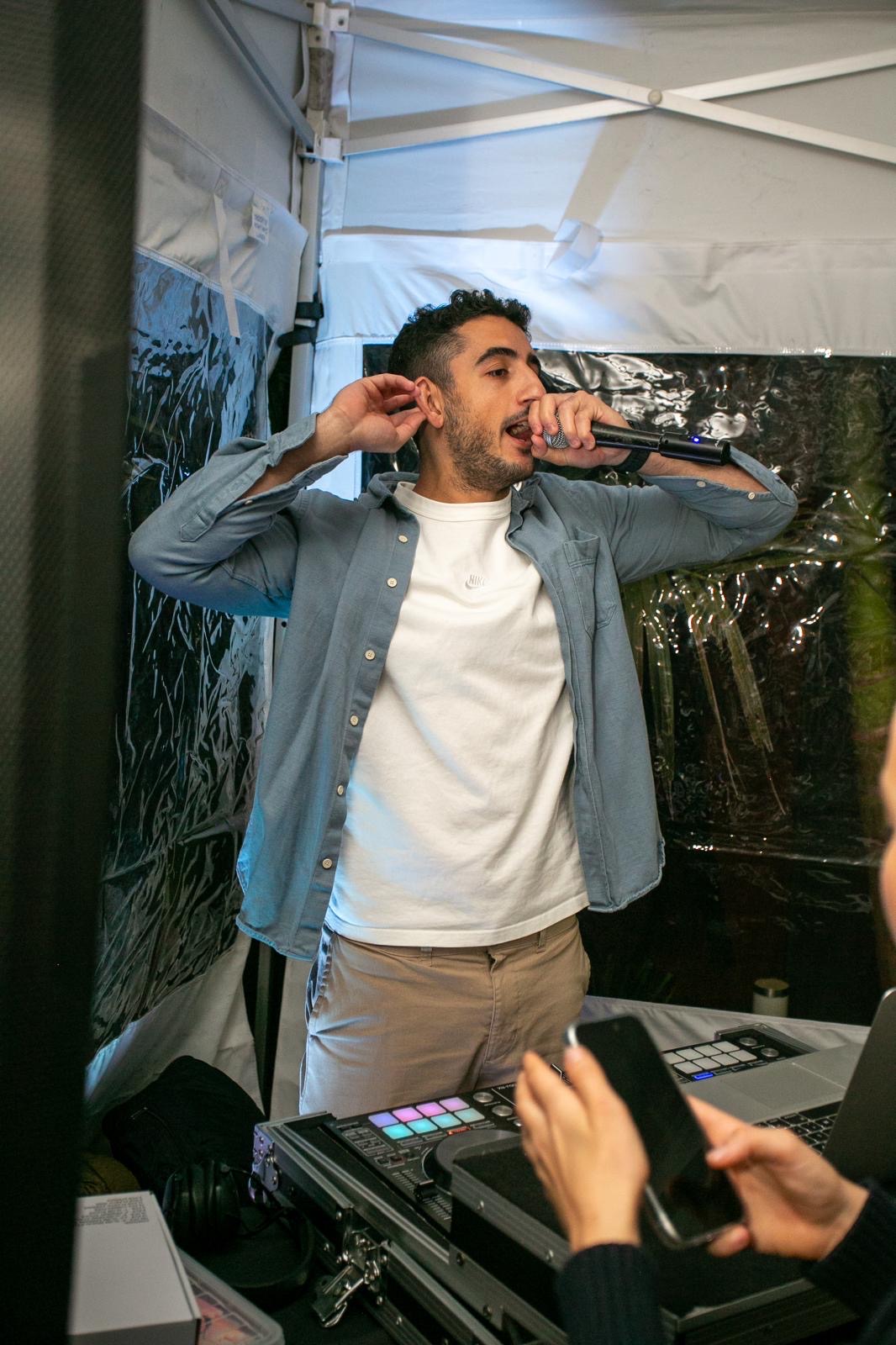 On the microphone hyping the crowd